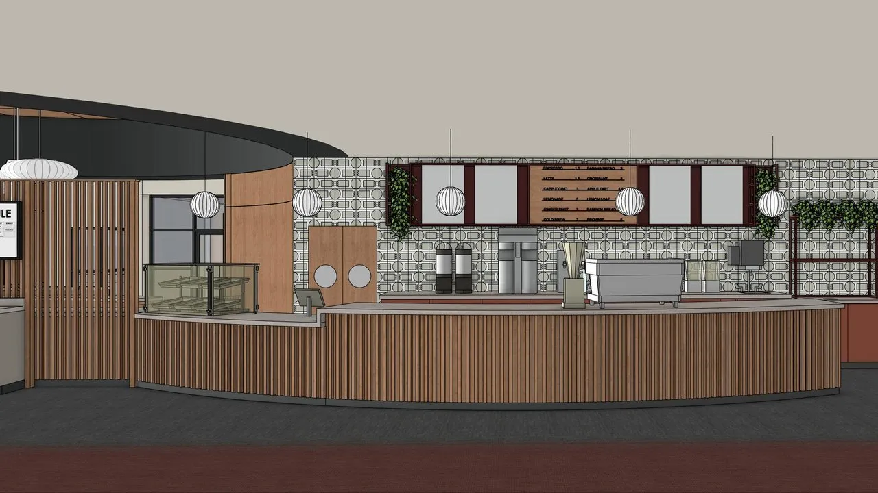A café counter with wood slats, coffee machines, menu boards and hanging globe lights.